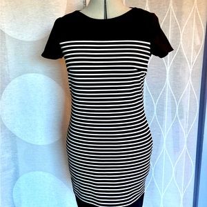 Ponte knit striped sheath dress with black yoke and trim.